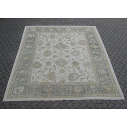 Beige and Celadon Border Oushak Rug