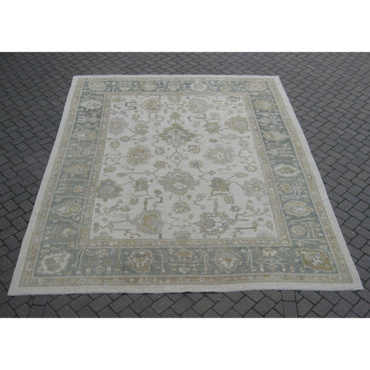 Beige and Celadon Border Oushak Rug